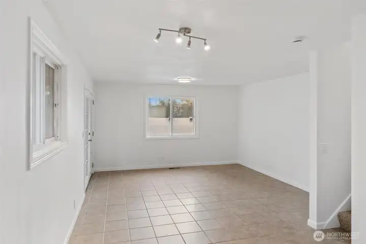 Dining area with steps up to the primary room.