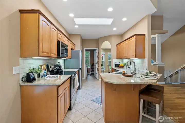 Open galley kitchen with barstool seating