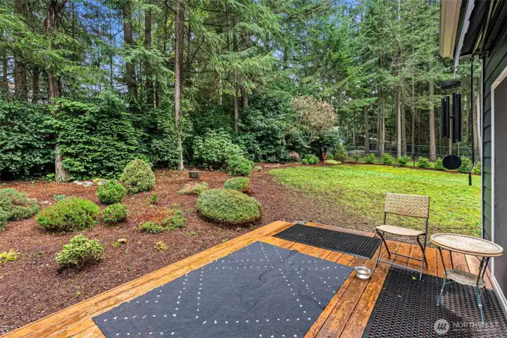 Deck off of the kitchen leads to fully fenced backyard