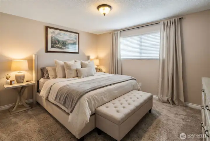 Virtually staged primary bedroom view 1