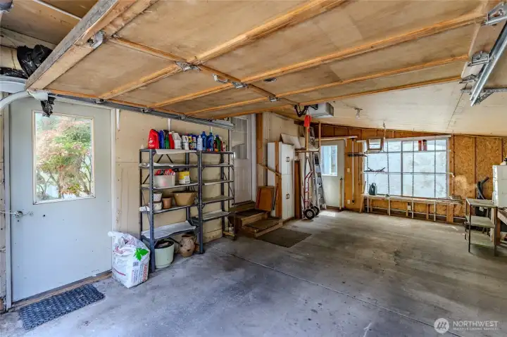 Garage with door to backyard.