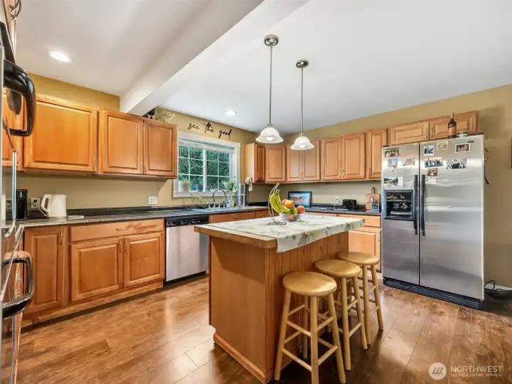 Beautiful kitchen with central island and lots of cabinets