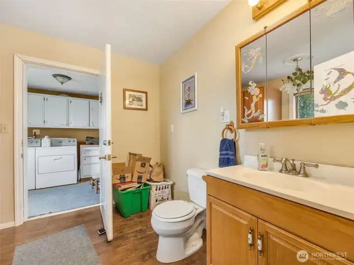 Main level half bath connected to the laundry