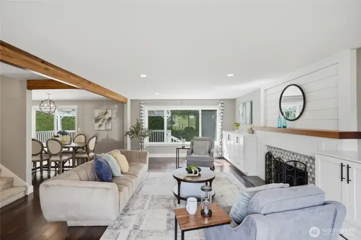 Open concept living room seamlessly connected to the dining area with easy access to the covered deck and backyard.