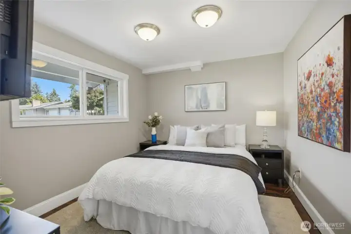 Main floor bedroom with abundant natural light and easy access to the adjacent full bathroom.