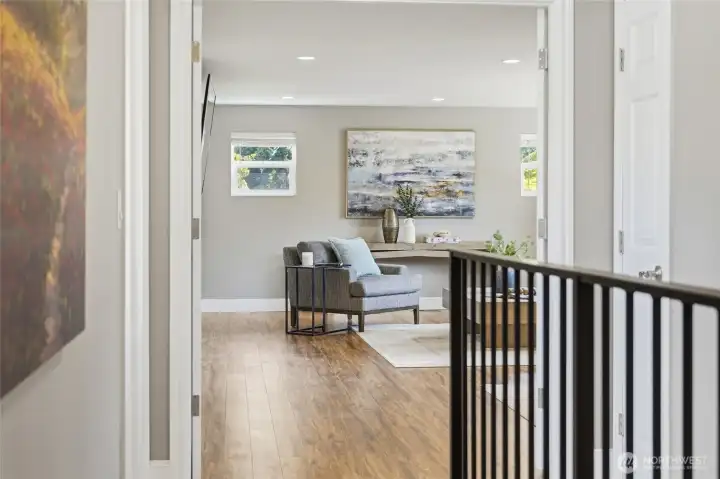 At the top of the stairs, an expansive bonus room offers exceptional flexibility for a media room, playroom, home office, or potential primary suite.