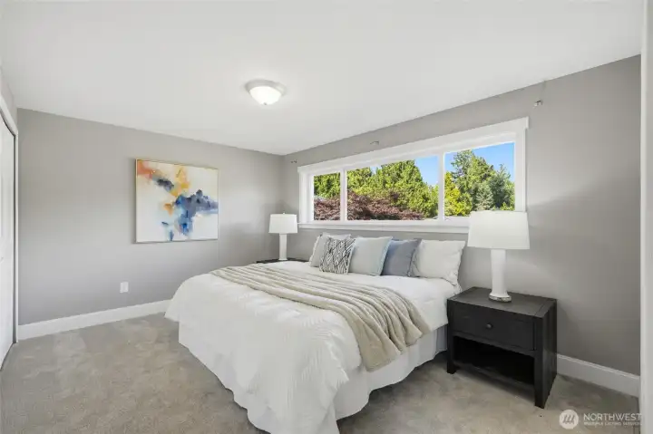 Large bedroom featuring with direct bathroom access, offering potential as an additional primary suite.