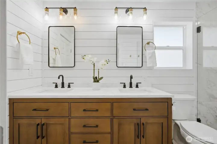 Dual-sink vanity provides ample storage and functionality for busy mornings.