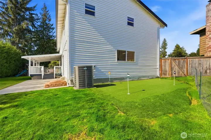 Turf putting green to sharpen your short game without leaving home.