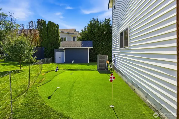 The storage shed provides plenty of room for lawn equipment, tools, and outdoor gear, helping keep everything organized.