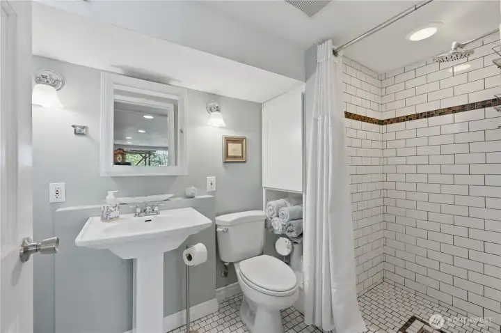 Three quarter bathroom in the lower level. Three quarter bathroom in the lower level.