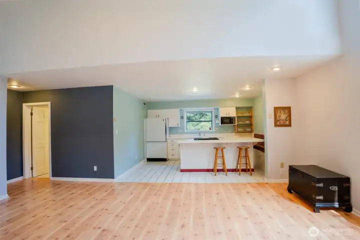 Looking through the living room to the kitchen. Looking through the living room to the kitchen.