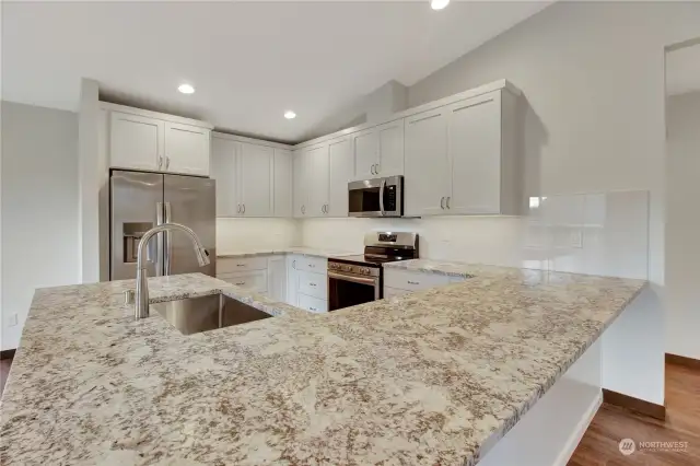 Bar seating with custom cut granite counter tops and plenty of storage!