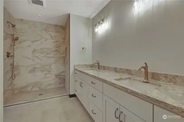 Primary Bathroom is spacious! Large tile shower with double vanity and mirrors now hung.