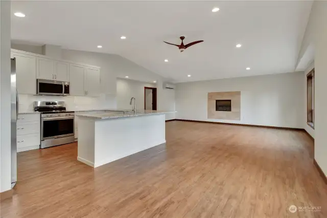 Spacious open concept! Custom kitchen with a propane fireplace waiting for you to add a your charm.