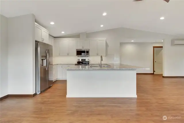 Convenient kitchen with U shaped layout. You can see the 2nd bedroom door to the right.