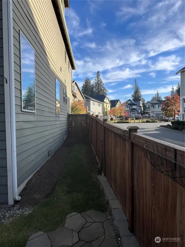 Side yard with view of neighborhood. Great corner lot.