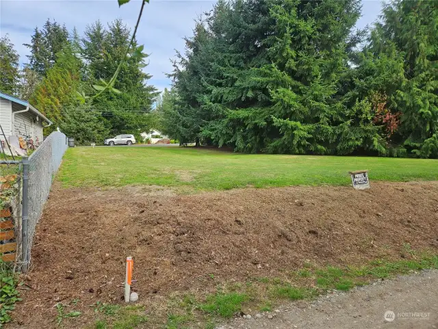 View from west side of lot from gravel alley