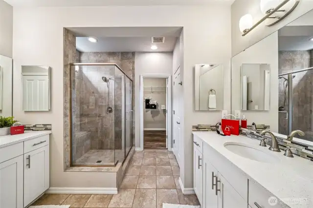 His and Her sinks on opposite walls, custom shower, walk in closet, and two linen closets.