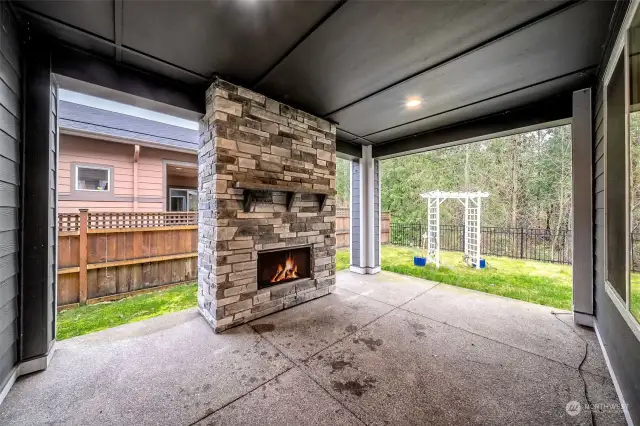 Covered patio with gas fireplace and removable custom shades