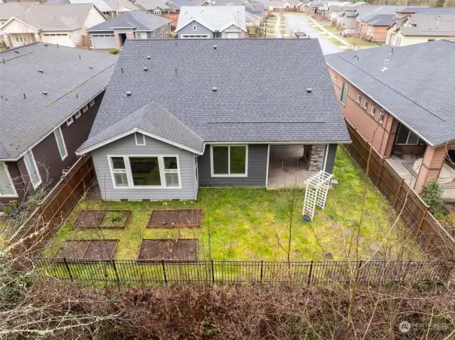 Set up perfect for gardening, adding your own touch with a sitting area, and custom fencing that allows you to fully enjoy the beautiful green belt.