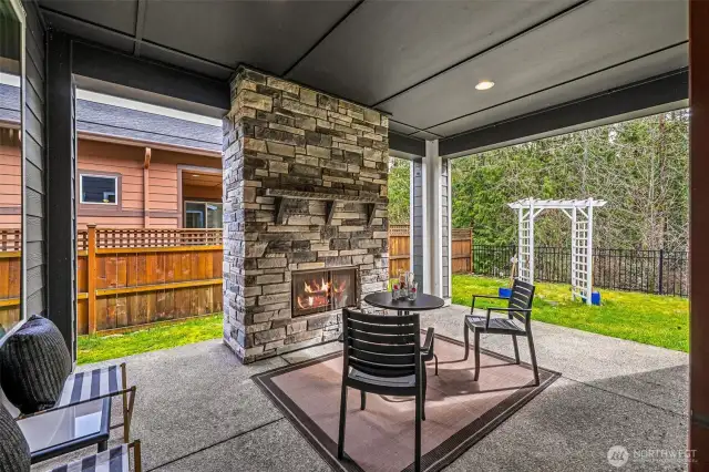 Covered patio with gas fireplace and removable custom shades