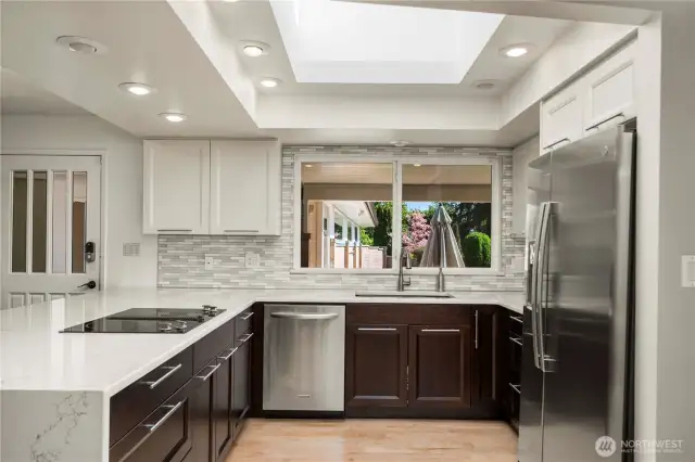Enjoy the recently updated kitchen with stainless appliances and waterfall counter