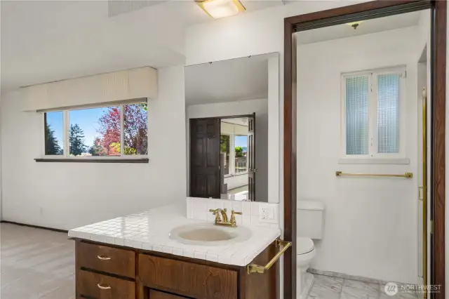 Update or create a new vision for this large ensuite bathroom.