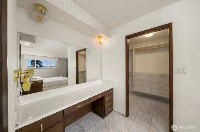 Convenient vanity adjacent to primary walk in closet