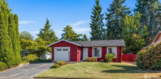 The extra wide driveway provides access to RV parking along the left side of the hopuse.