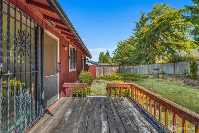 The back deck is off the dining room.