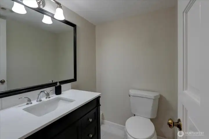 Guest bath on the main floor near the entry, family room and laundry.