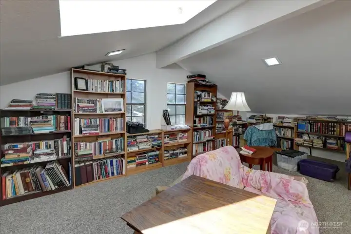Located over the garage, the bookroom features skyights and very generous floor space.