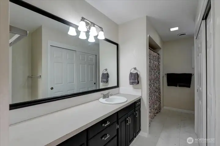 2nd floor bath features long counter, tub/shower, huge linen closet, and toilet, of course.