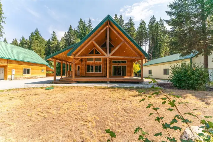 Main home with 2 large outbuildings on either side