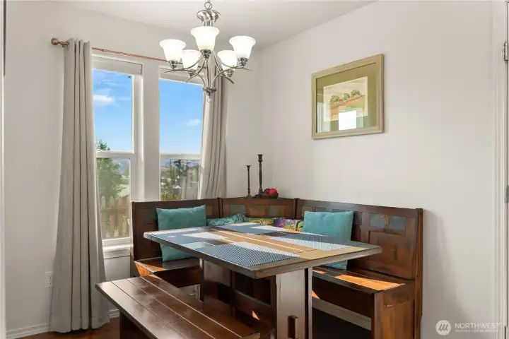 Cozy dining nook, with a view overlooking the front yard and beyond.