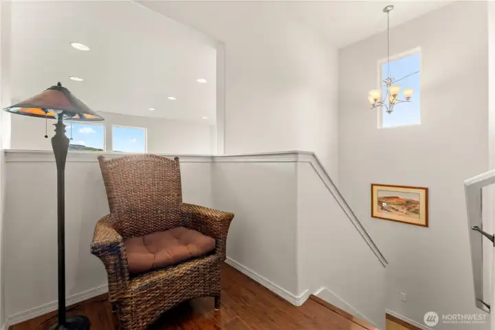 A cozy reading nook greets you as you come up the stairs to the second level.