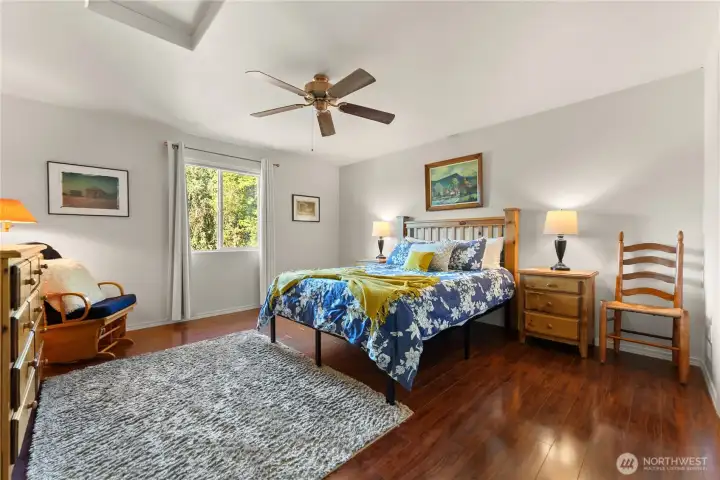 Bright and inviting upstairs bedroom with plenty of natural light.
