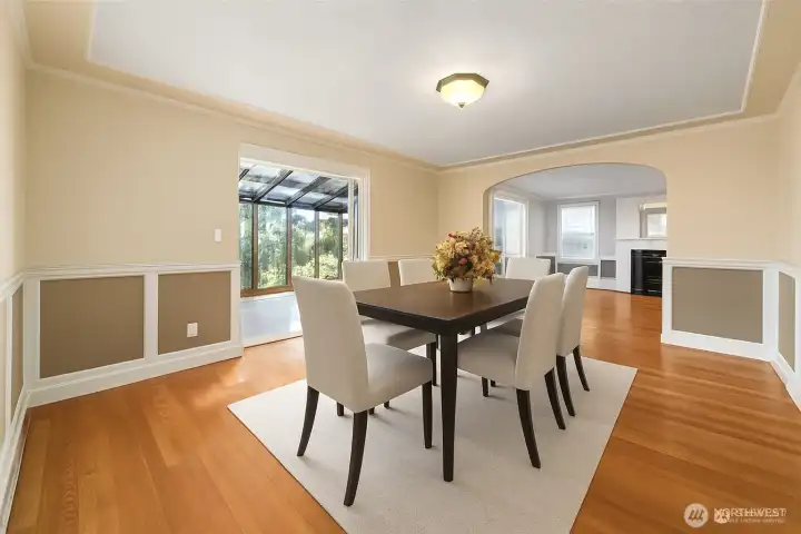 Virtually staged large dining room.