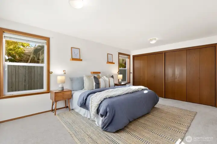 Spacious primary bedroom sits at back of house.