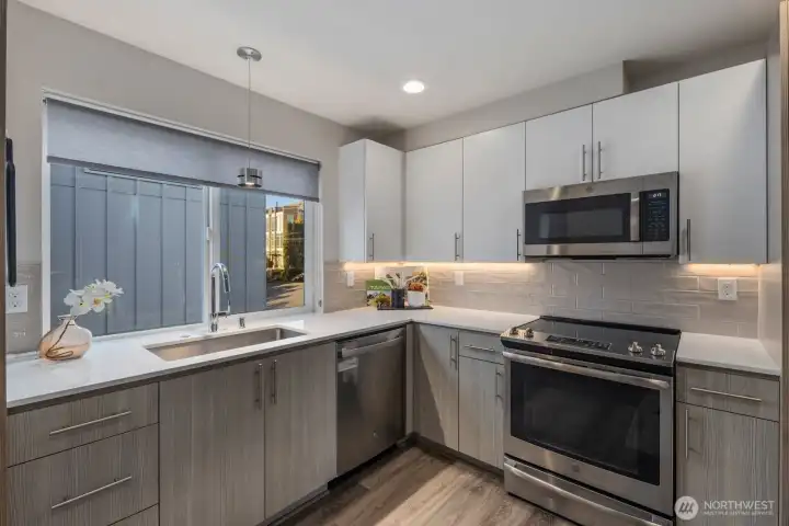 Chef's kitchen with designer finishes and under-cabinet lighting.