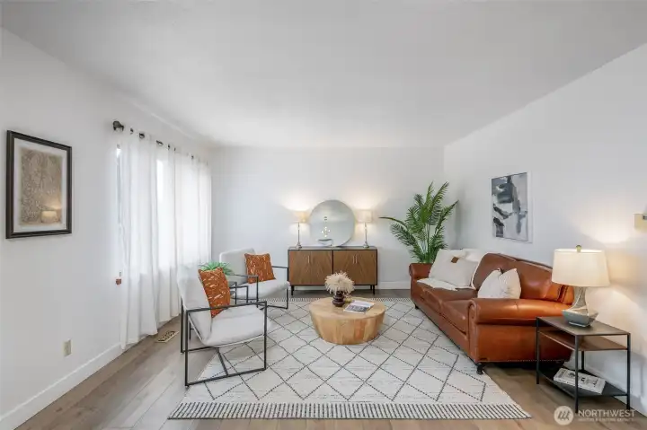 Living room is drenched by natural light throughout the day