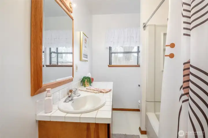 Full bath off living room, adjacent to bed #1