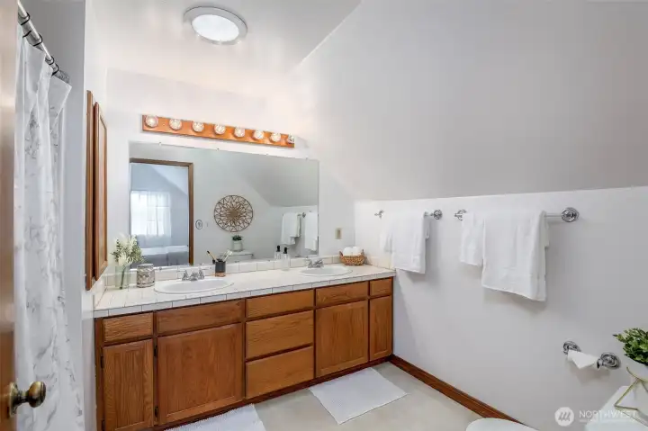 Primary ensuite- full bath, double sinks, solar tube skylight, storage and room to roam!