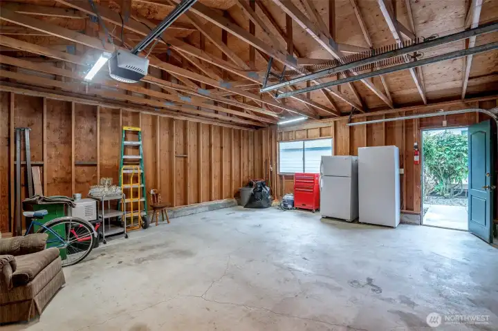Garage is immaculate features auto garage door. Fridge/freezers stay!