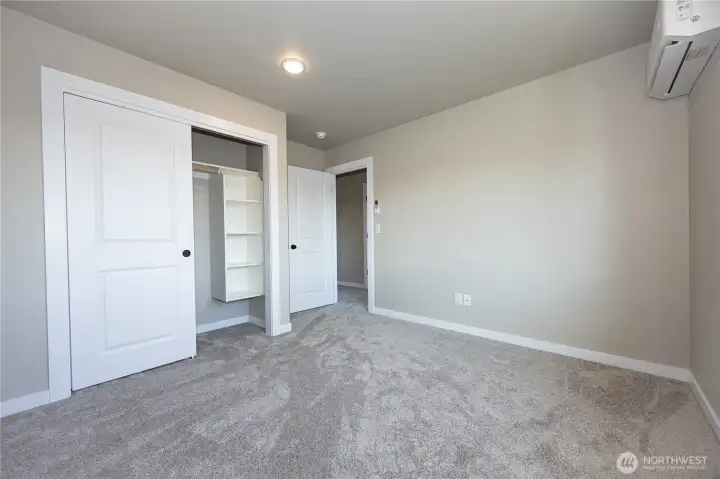 Closet in bedroom #1 has quality built-in shelves