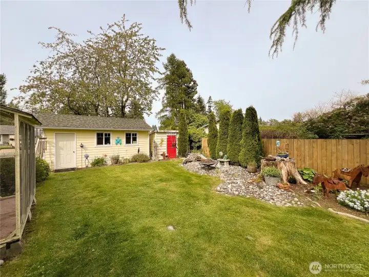 Another view of detached garage and back yard.