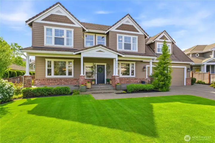 Welcome to 5214 77th Ave Ct W, an elegant retreat in the gated Berkshire neighborhood of University Place.