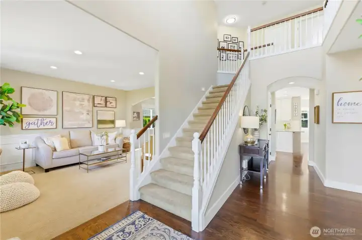 Step inside to a blend of warmth, elegance, and functionality, featuring gleaming hardwoods and abundant natural light.