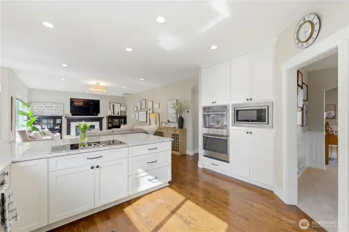 The kitchen opens seamlessly to the eating nook and cozy family room beyond.
